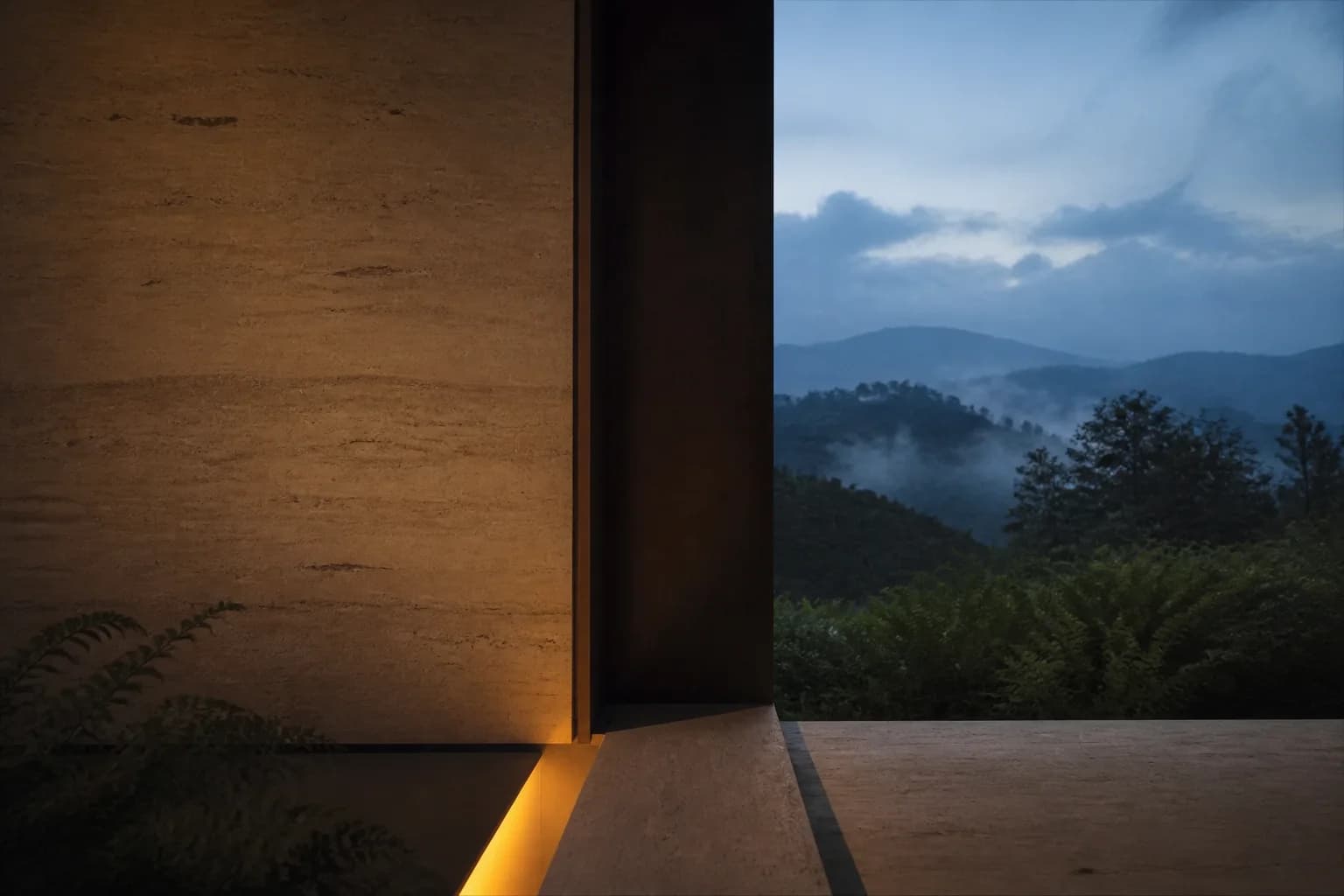 Muro de tierra apisonada iluminado frente a la montaña